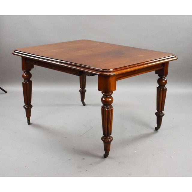 A handsome Victorian mahogany extending dining table, offering a practical and versatile size with a warm, rich finish and...