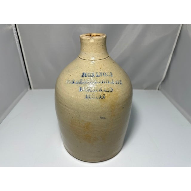 Antique John Lyons Stoneware Whiskey Jug for your consideration. The jug measures approx. 11 1/2 inches tall. Base...