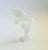 A vintage lucite flower sculpture. The flower, leaves, and base have a frosted finish with a clear lucite stem. A...