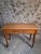 This vintage beechwood office desk features a rectangular top with an inset linoleum writing surface and a single drawer...