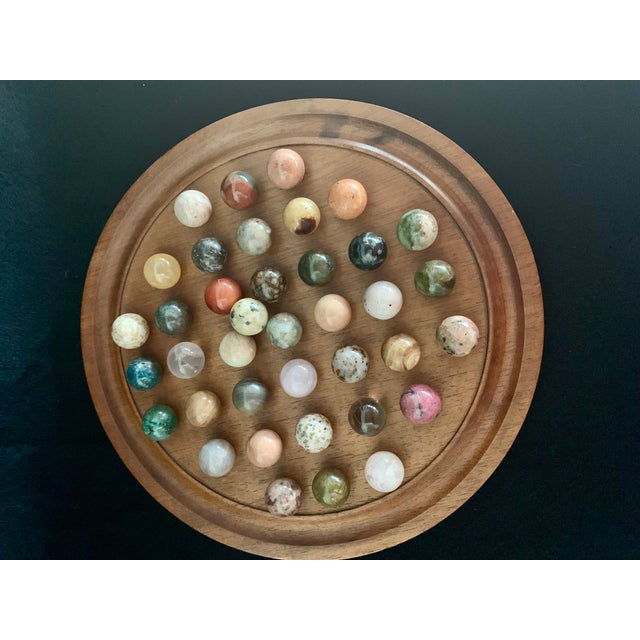 This is a beautiful, highly collectible Vintage Wooden Peg Solitaire Board Game Set complete with a stunning collection of...