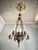 Magnificent seven-light French chandelier, crafted from bronze, majolica, and crystal, dating back to the 1930s. It is...