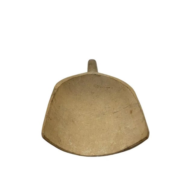 Hand carved from a single piece of wood, this rustic vintage grain scoop from Hungary has wonderful patina and soft...
