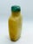 The soft yellow honey color jade snuff bottle has a flattened rectangular form slightly tapering towards the flat foot...