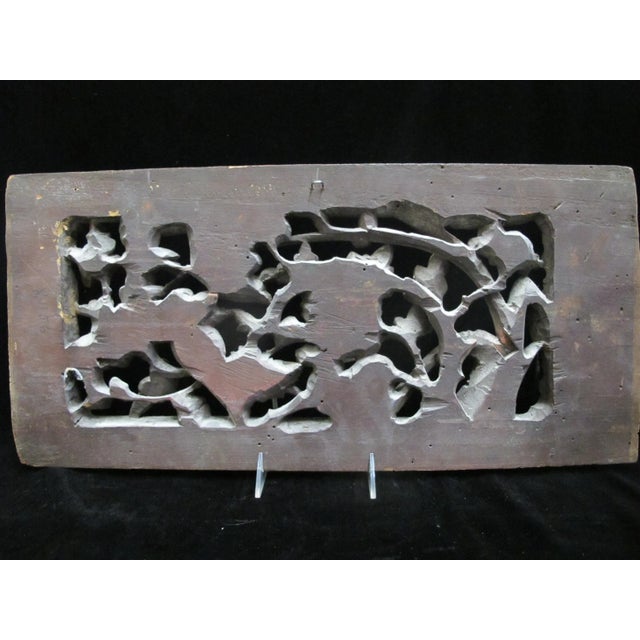 Chinese gilt and red pierced 3d wood carving of 2 birds and a goat amongst flowers. Measures 21 1/2" x 10" x 1". Good...