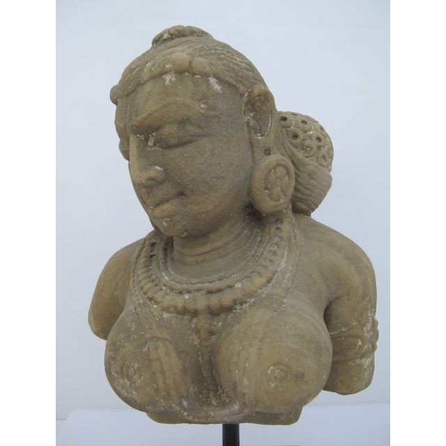 Antique Rajasthan style Hindu bust. Carved stone Apsara or Devata statue. Devatas and Apsaras are divine or semi-divine...