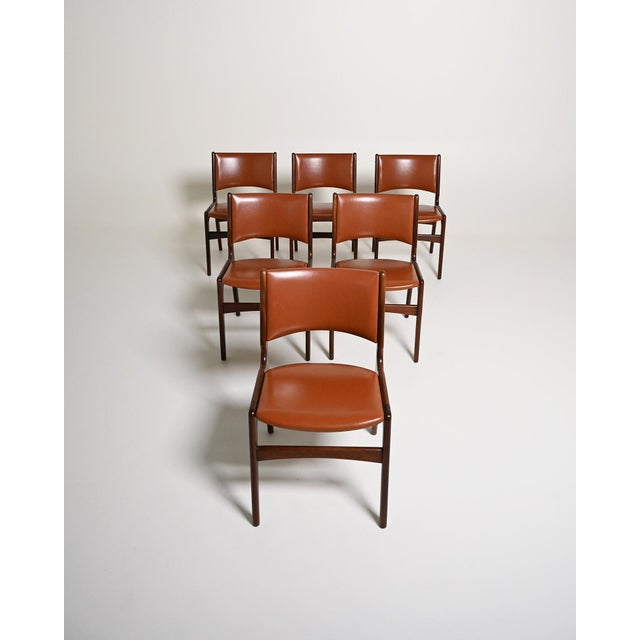 Teak dining chairs with brown leather-upholstered seat and back. Danish production, 1960s. Designed by Erik Buch as "Model...