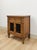 This distinctive vintage MCM transitional nightstand is a well-made and characterful bedside find. The iron grate cabinet...