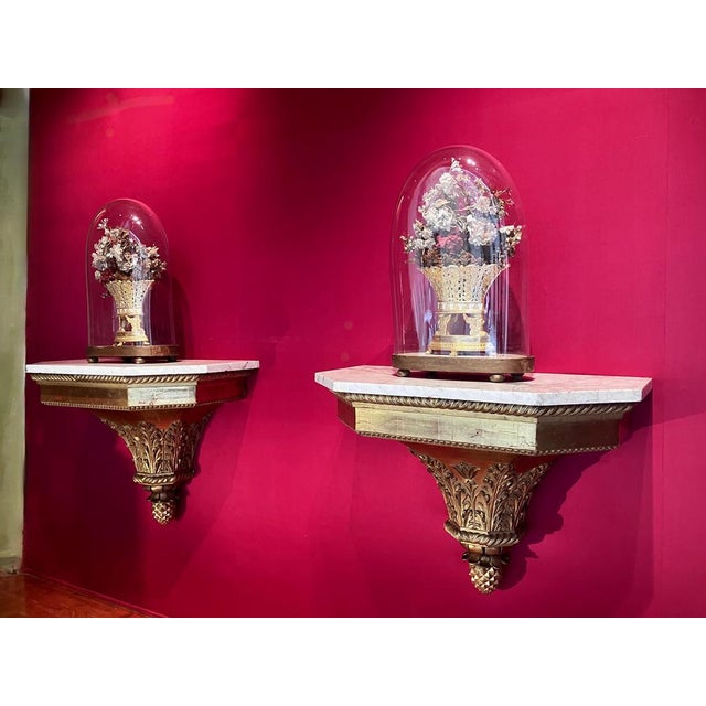 This exceptional and rare pair of italian 18th century louis xvi period wall mounted consoles are finely hand carved,...