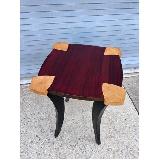 Jeffrey Green postmodern table made out of mahogany and curly maple with curved black lacquer legs. Great little accent...