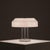 The abn table lamp was designed by dutch designer aldo van den nieuwelaar in 1975 as a commission for the dutch abn bank....