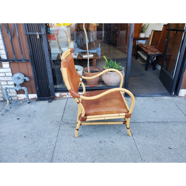 Stunning, vintage arm lounge chair. The chairs frame is made out of bamboo, some parts are bent bamboo and seems like they...