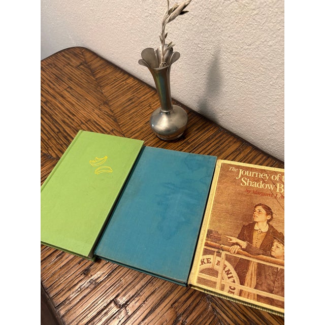 Introduce a confident burst of narrative charm and lively color to your design vignette with this curated 3-book stack of...