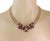 This is a stunning necklace, it is crafted from 18k and 14k yellow gold. The 18k gold centerpiece features 3 section...