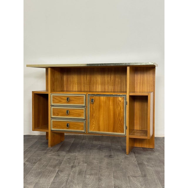 A stunning and imposing entryway console or vintage bar cabinet, featuring a refined and rigorous geometric design of...