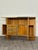 A stunning and imposing entryway console or vintage bar cabinet, featuring a refined and rigorous geometric design of...