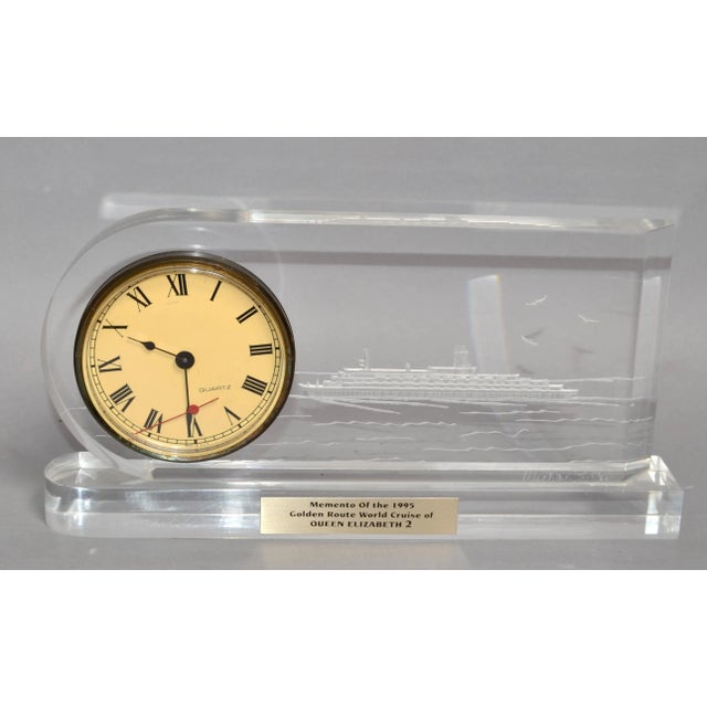 Late 20th Century Solid Lucite Desk Clock Reversed Etched Nautical Picture of the Queen Elizabeth 2 at See. Signed by the...