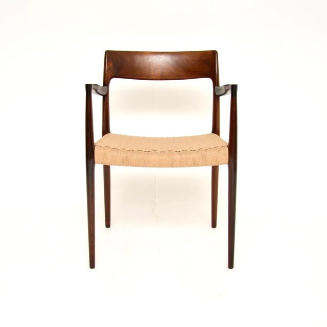 An exceptional Danish vintage model 57 chair by Niels Moller. This was made in Denmark by JL Moller Mobelfabrik, it dates...