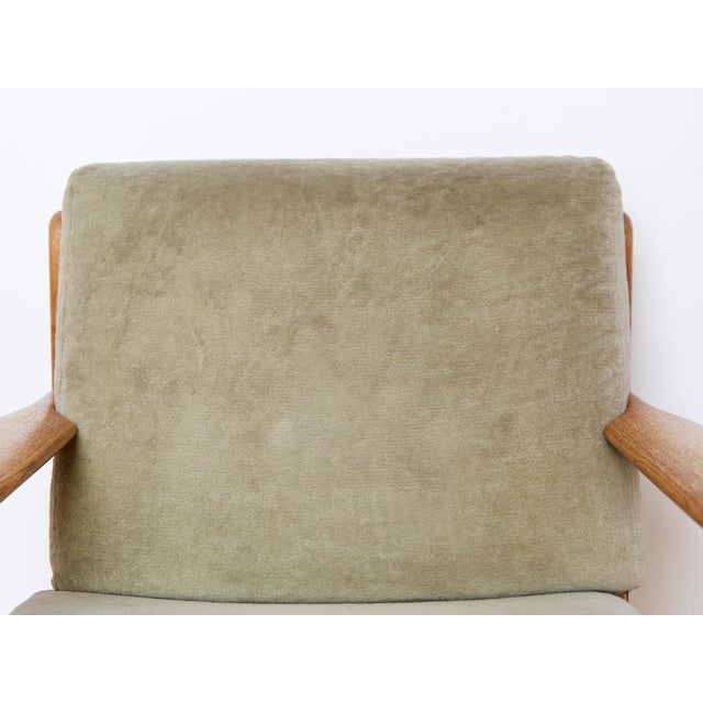 Beautiful, minimalist Easy Chair by the Danish designer Poul M.Volther. The frame is made of solid oak wood. The loose...