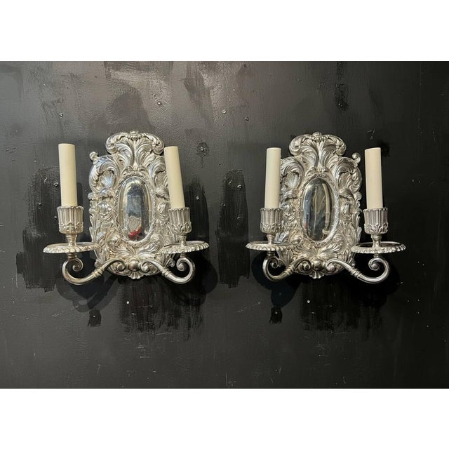 1900's pair of silver plated Baroque style Caldwell sconces with two lights