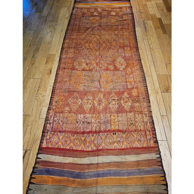 This vintage Moroccan Rabat wide runner from the early 20th century is a beautiful example of the distinguished Rabat...