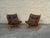 Pair of vintage Scandinavian Modern lounge chairs, circa 1970s. Each features a sculptural bent wood frame with a...