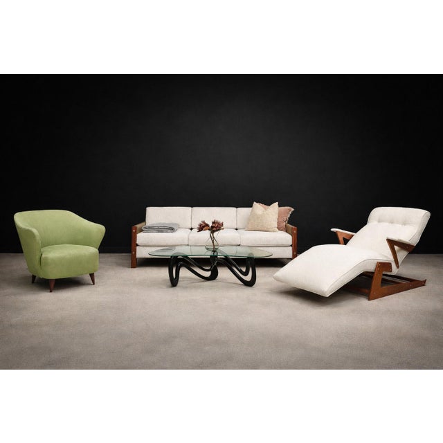 Attributed to Joaquim Tenreiro, this “Concha” armchair dates to the 1950s and exemplifies the organic refinement that...