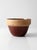 Antique stoneware mixing bowl with a classic, substantial form and a warm, grounded presence. The wide banded rim in soft...