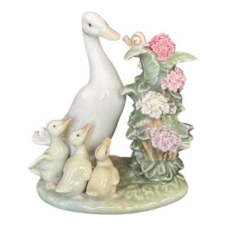 1980s Porcelain "How Do You Do? Duck Figurine From Lladro, Featuring a Mother Duck, Three Ducklings, and a Snail on a Flowering Branch. For Sale