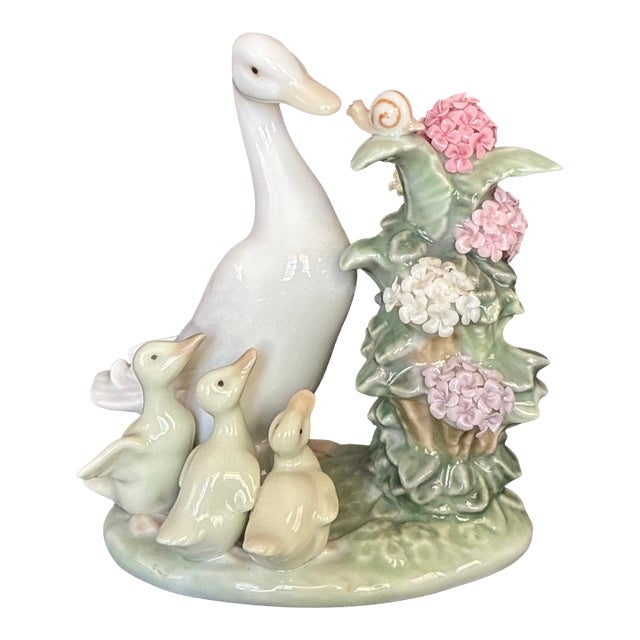 1980s Porcelain "How Do You Do? Duck Figurine From Lladro, Featuring a Mother Duck, Three Ducklings, and a Snail on a Flowering Branch. For Sale