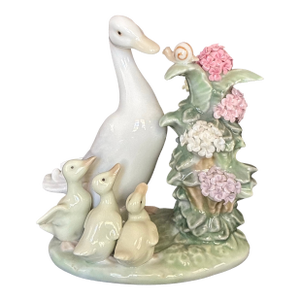 1980s Porcelain "How Do You Do? Duck Figurine From Lladro, Featuring a Mother Duck, Three Ducklings, and a Snail on a Flowering Branch.