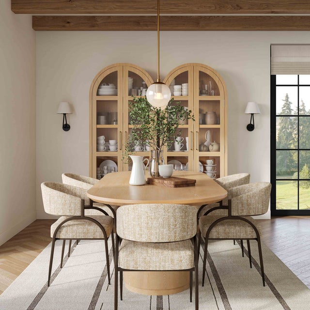 The Marlow Oval Dining Table combines refined elegance with a modern design. Finished in a natural wood, this table...