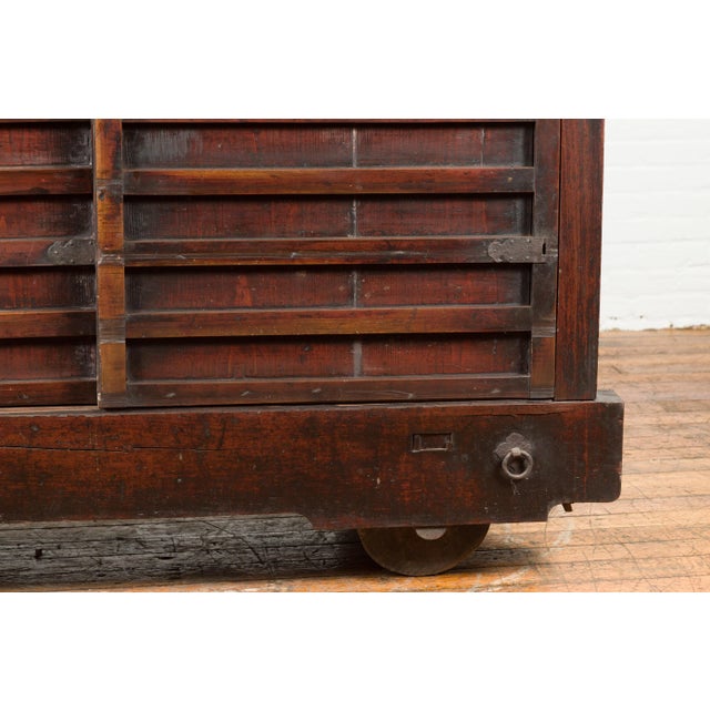 Chocolate Japanese Meiji Period Late 19th Century Merchant's Chest Mounted on Wheels For Sale - Image 8 of 12