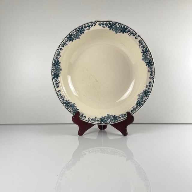 Low salad bowl, "Tunis" pattern, by Longwy, late 19th century. Blue tones Dimensions: Diameter: 28 cm Height: 5 cm This...