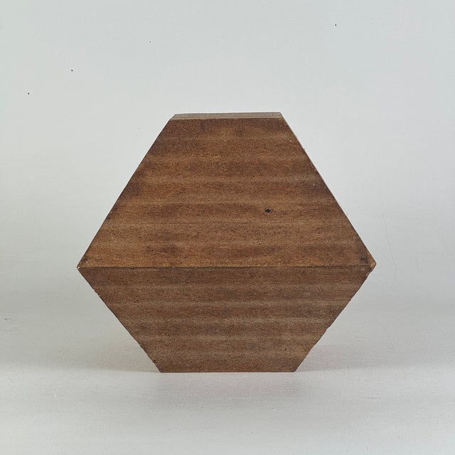 An original Mid-Late 20th Century handmade wooden sculpture. it is simple in its faceted polyhedron approach and...