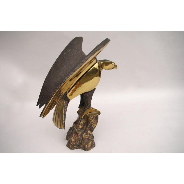 Daniel Chassin, signed. Polished soldered gilt brass sculpture figuring an eagle, which takes flight, with wings slightly...