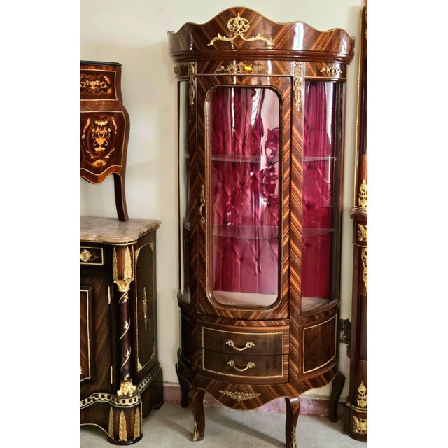 Elevate your interior with this magnificent luxury vitrine cabinet, crafted in the finest European tradition. Featuring a...
