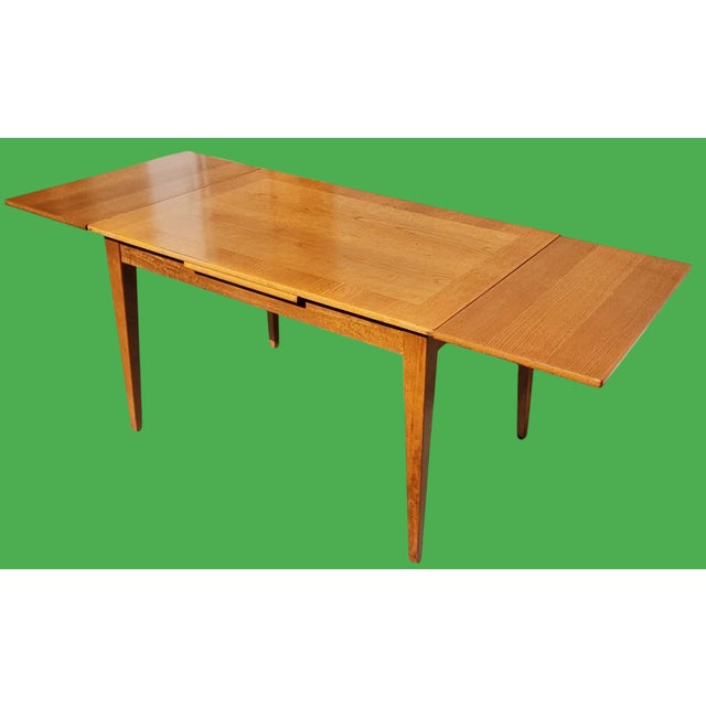 This Vintage Cross-Banded Solid Oak Extendable Dining Table is a beautiful representation of elegant design that meets...