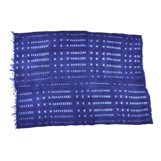 The cloth is made from Indigo resist-dyed cotton. This textile probably comes from the Dogon or Mossi people of Mali and...