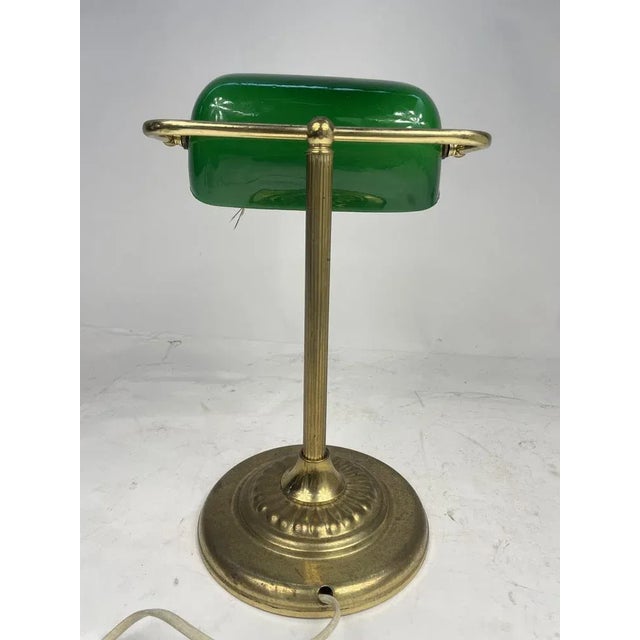 Iconic "Ministerial" table lamp in worked brass and green glass. excellent piece of furniture, in perfect working order....