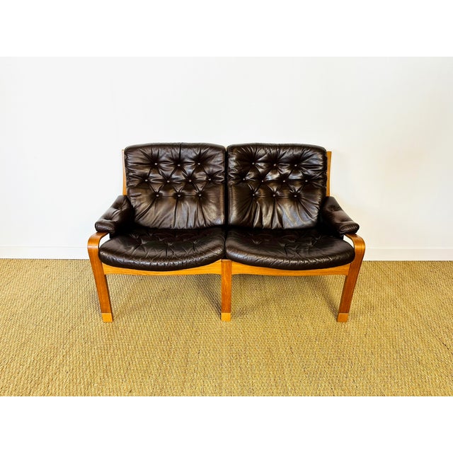 Elegant vintage scandinavian two-seater sofa in excellent condition, dating from the 1960s. bent oak frame with teak...