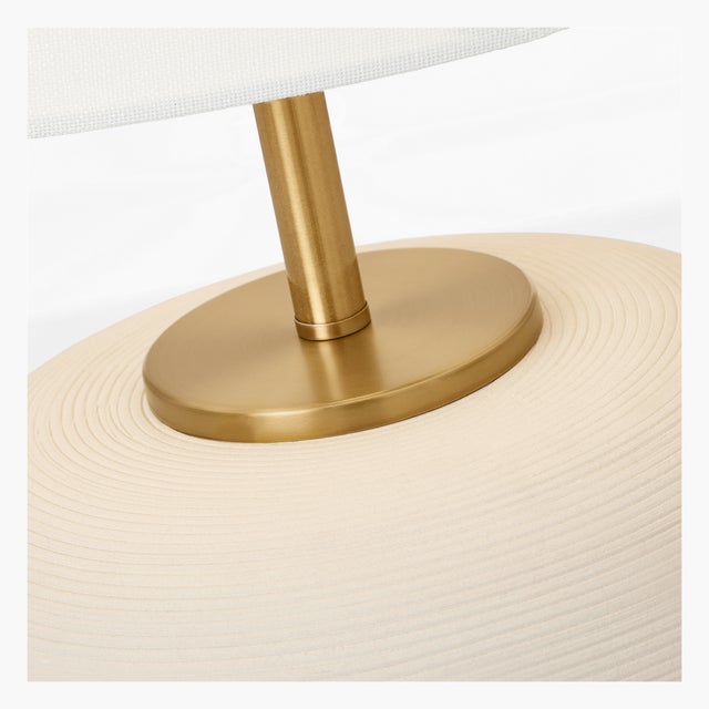Clean lines and elemental materials lend an iconic quality to the Fanny table lamp by Hable. Available in a slim and wide...