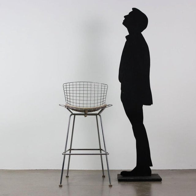 Stool in the style of Harry Bertoia. Chromed metal and leatherette cushion. This piece is attributed to the mentioned...