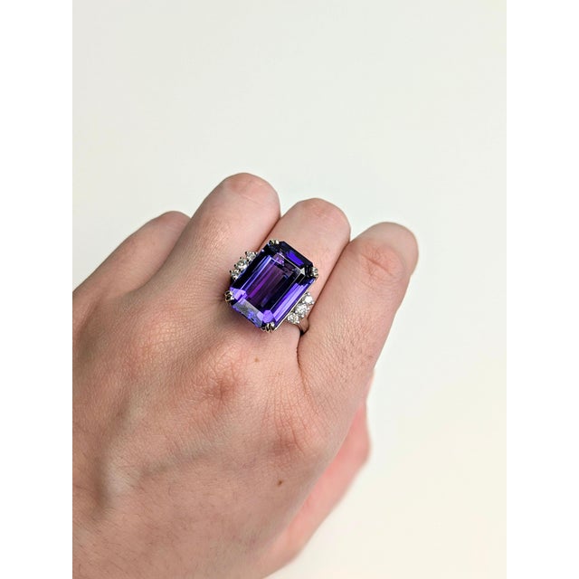 An AAA tanzanite takes centre stage in a deep violet-blue at the centre of this solid 14K white gold ring, surrounded by...