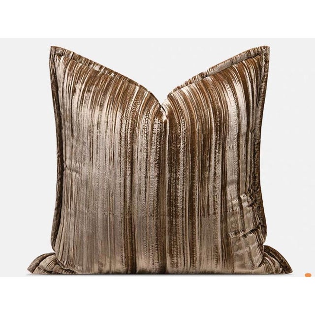 This square throw pillow is crafted from a warm brown velvet fabric, adorned with delicate vertical textures that reflect...