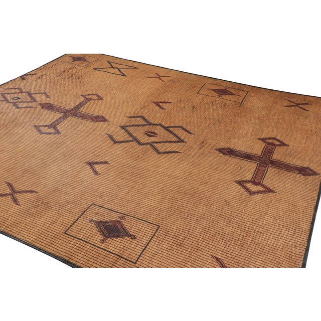This vintage 8x10 Moroccan Tuareg rug, handwoven in reed and leather circa 1950–1959, showcases striking tribal geometry...