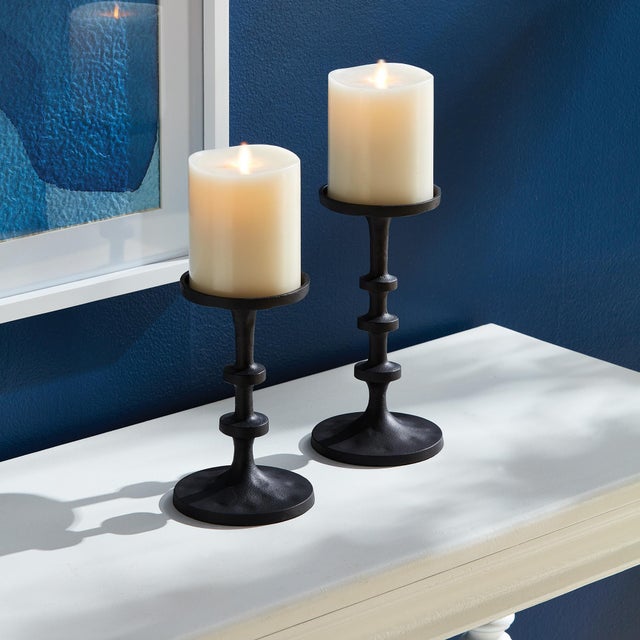 In a playful nod to the old way of counting, the notches along the body of these candle stands add a modern touch. This...