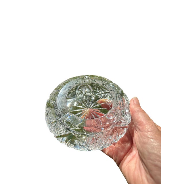 Vintage heavy cut crystal glass ashtray from Europe. 5” round x 1.5” tall Thick blank with cut buzz stars, fans, miter...