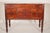 George III mahogany concave front sideboard, circa 1800. With a concave top with two hinged doors. below are two outer...