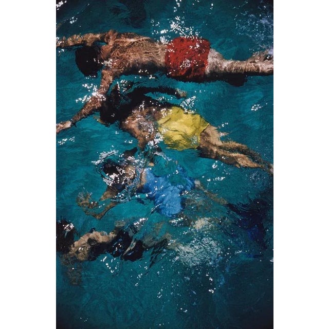 Swimming In The Bahamas 1959 by Slim Aarons Slim Aarons Limited Estate Edition Brightly coloured swimmers in a pool in...